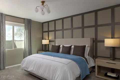 a bedroom with a bed and window