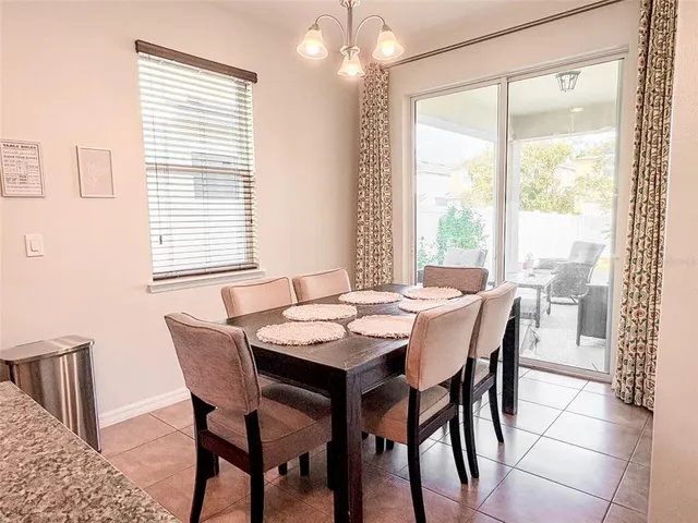 a white toilet sitting next to a window