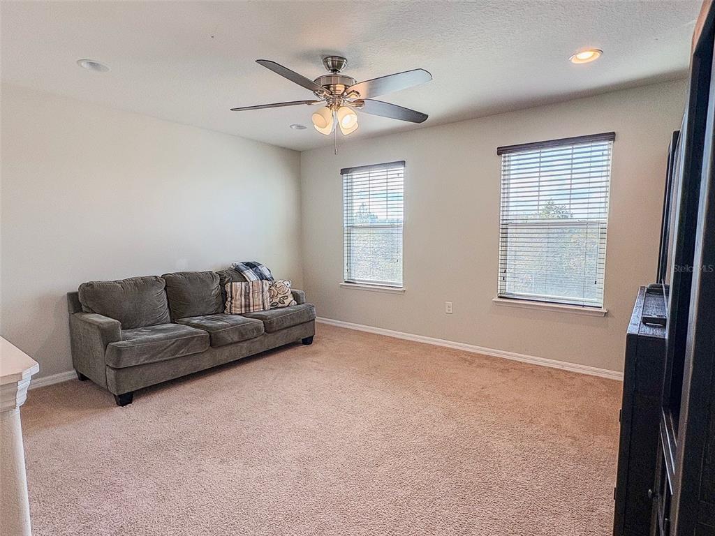 8607 Randal Park Boulevard Orlando, FL 32832 - Photo 25 of 51 a living room with furniture and a window