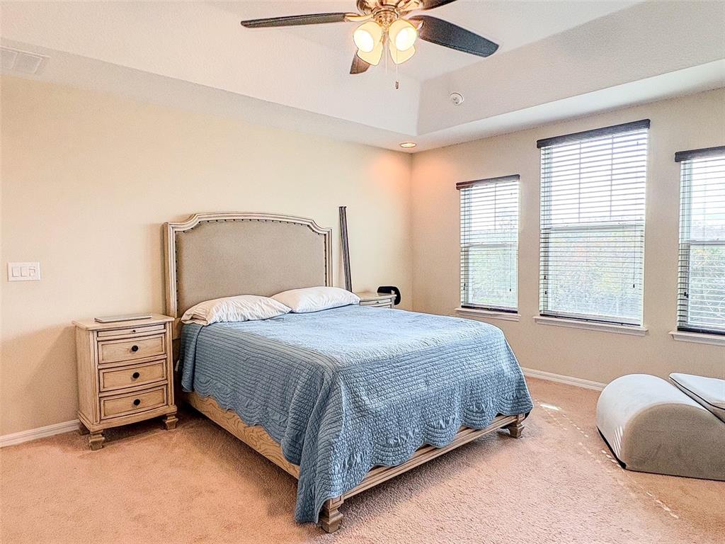 8607 Randal Park Boulevard Orlando, FL 32832 - Photo 28 of 51 a bedroom with a bed and window