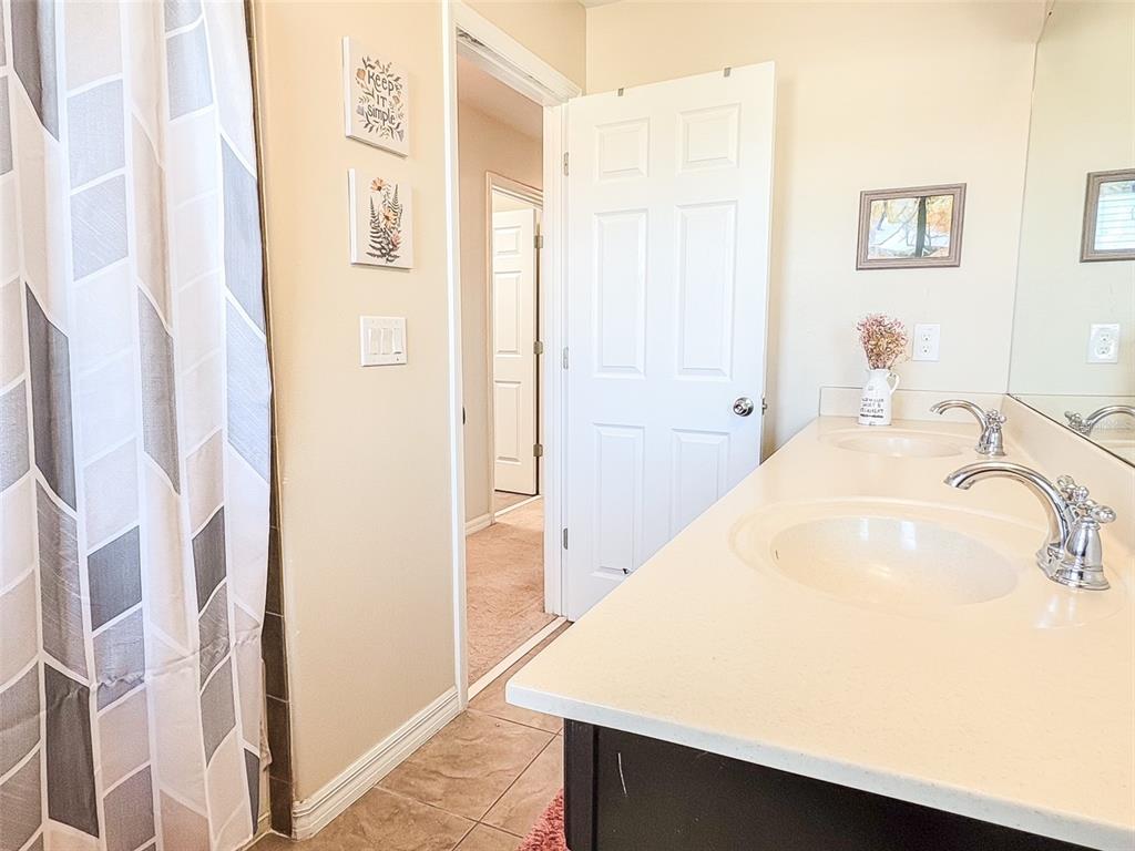 8607 Randal Park Boulevard Orlando, FL 32832 - Photo 40 of 51 a en suite bathroom with a sink