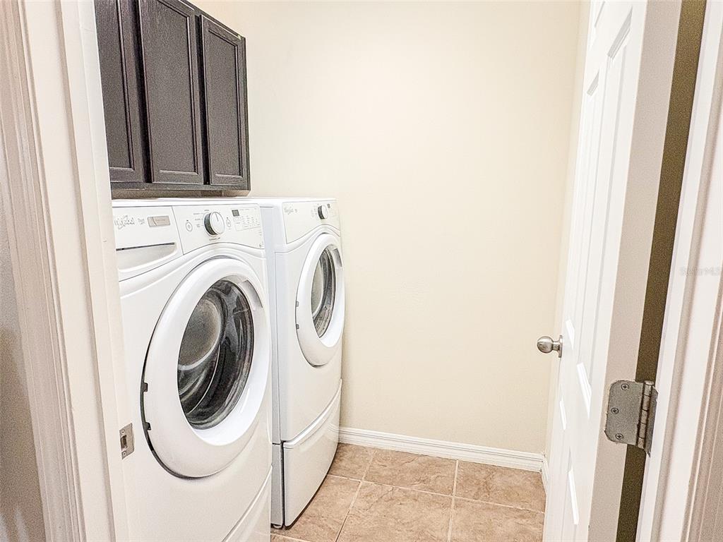 8607 Randal Park Boulevard Orlando, FL 32832 - Photo 41 of 51 a utility room with dryer and washer