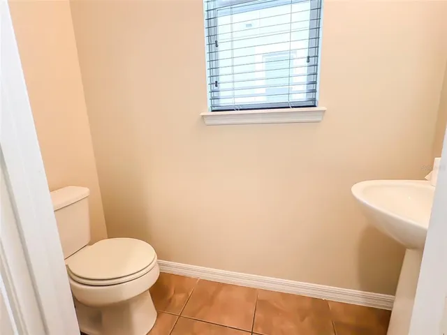 a kitchen with stainless steel appliances granite countertop a sink a stove and a microwave