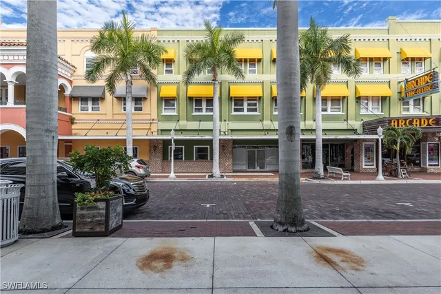 a view of a building with sitting area