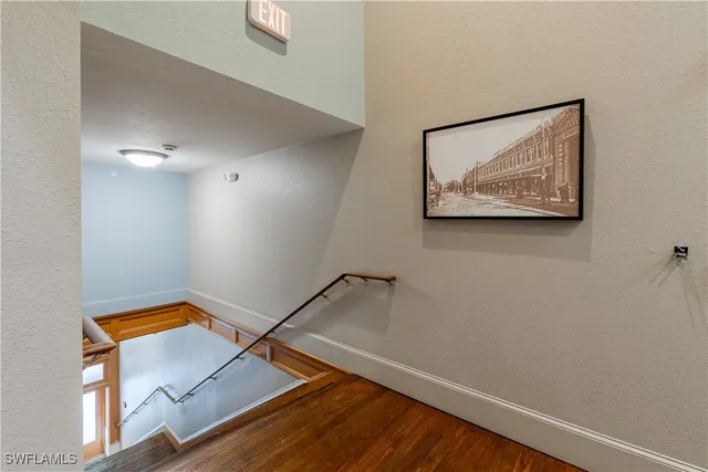 a view of an entryway with wooden floor