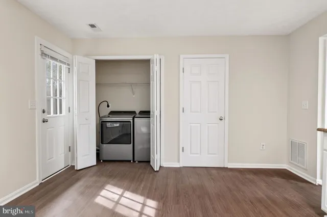 a view of a kitchen with a sink a refrigerator and window