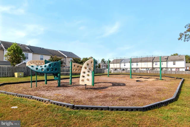 a view of a swimming pool with an outdoor seating