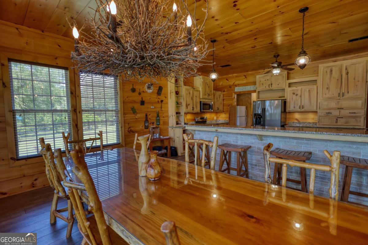 947 Bellhouse Road Macon, GA 31217 - Photo 11 of 100 a view of a dining room with furniture window and wooden floor