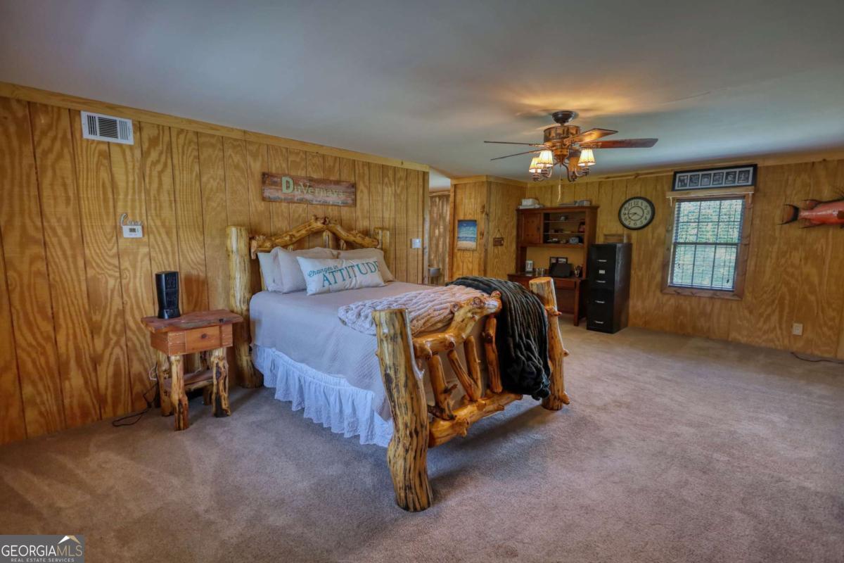 947 Bellhouse Road Macon, GA 31217 - Photo 30 of 100 a bed room with a bed and a ceiling fan