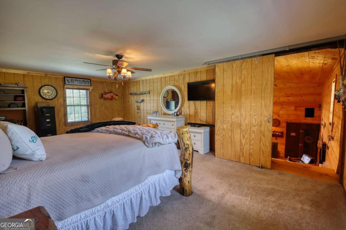 947 Bellhouse Road Macon, GA 31217 - Photo 31 of 100 a bedroom with a bed and a large mirror on dresser