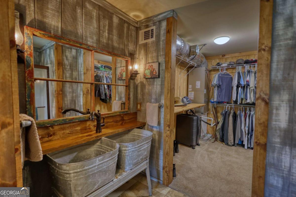 947 Bellhouse Road Macon, GA 31217 - Photo 36 of 100 a view of walk in closet with clothes and shoes