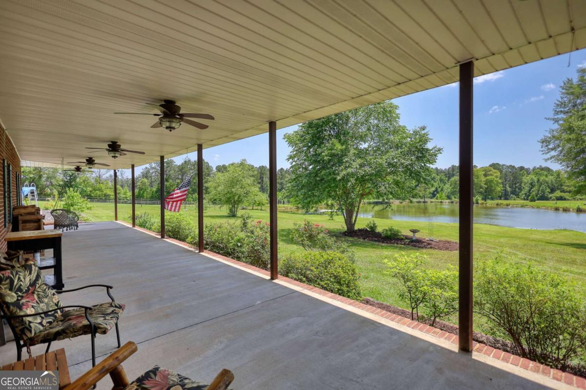 947 Bellhouse Road Macon, GA 31217 - Photo 40 of 100 a view of a patio with a table chairs and a backyard