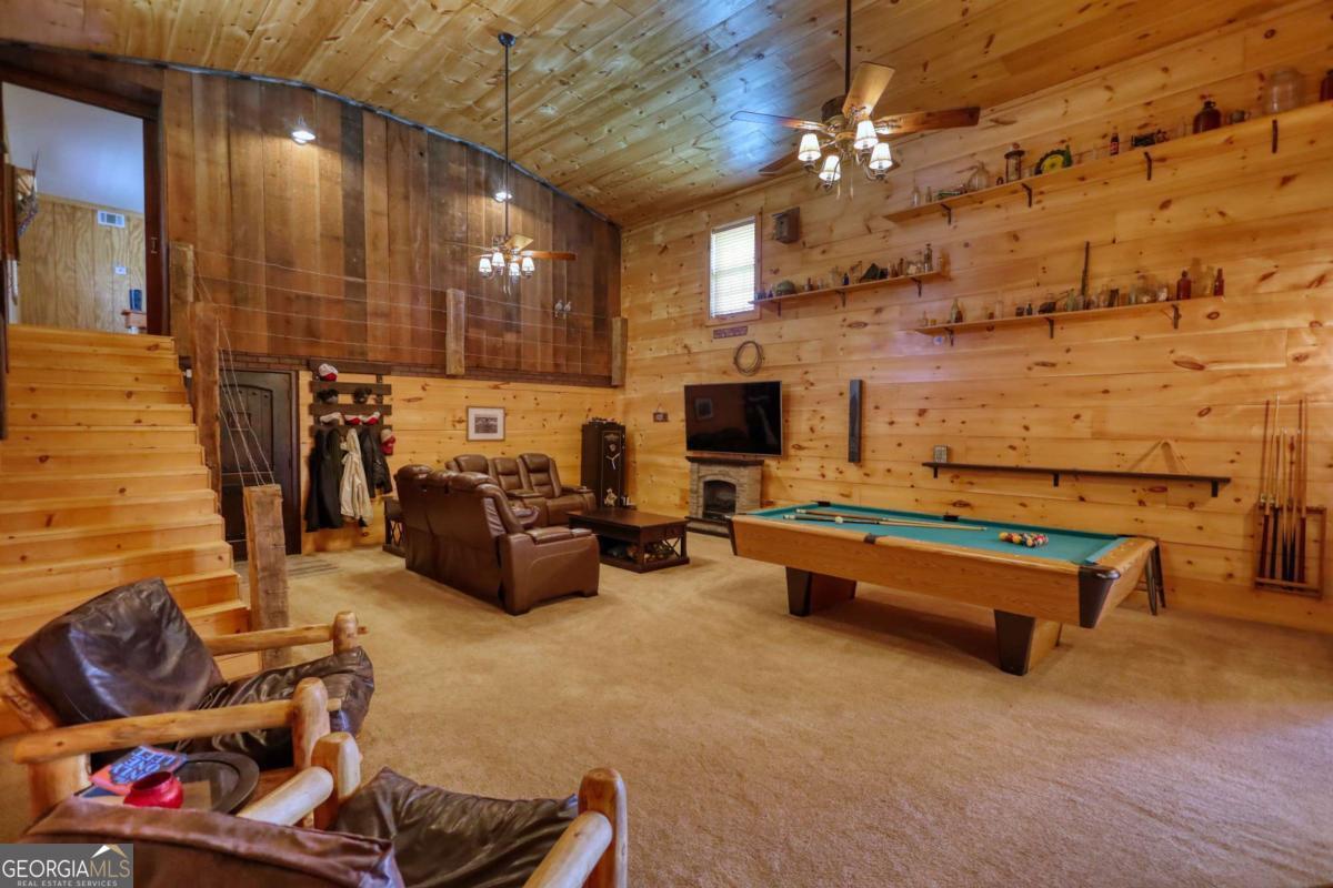 947 Bellhouse Road Macon, GA 31217 - Photo 5 of 100 a living room with furniture a pool table and chairs