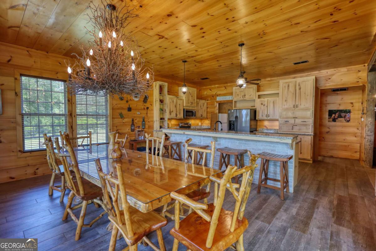 947 Bellhouse Road Macon, GA 31217 - Photo 10 of 100 a dining room with furniture and wooden floor