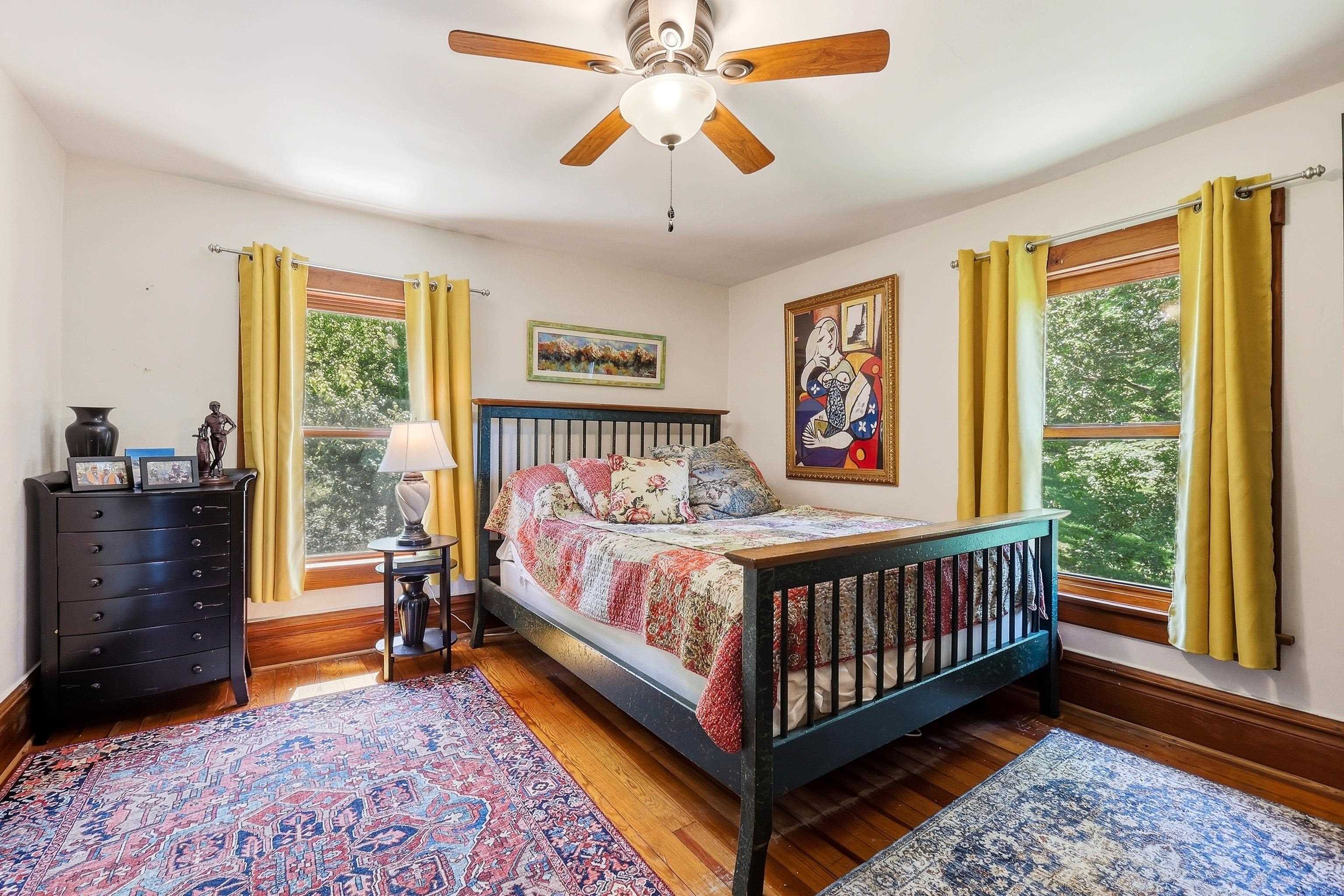 2181 South Irish Hollow Road Galena, IL 61036 - Photo 28 of 48 a bedroom with a bed and a chandelier