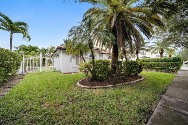 a house with tree in front of it