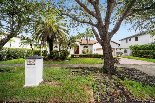 an empty room with wooden door and windows