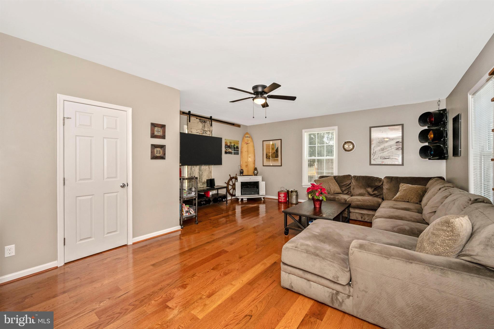 12529 Fingerboard Road Monrovia, MD 21770 - Photo 4 of 55 a living room with furniture and a flat screen tv