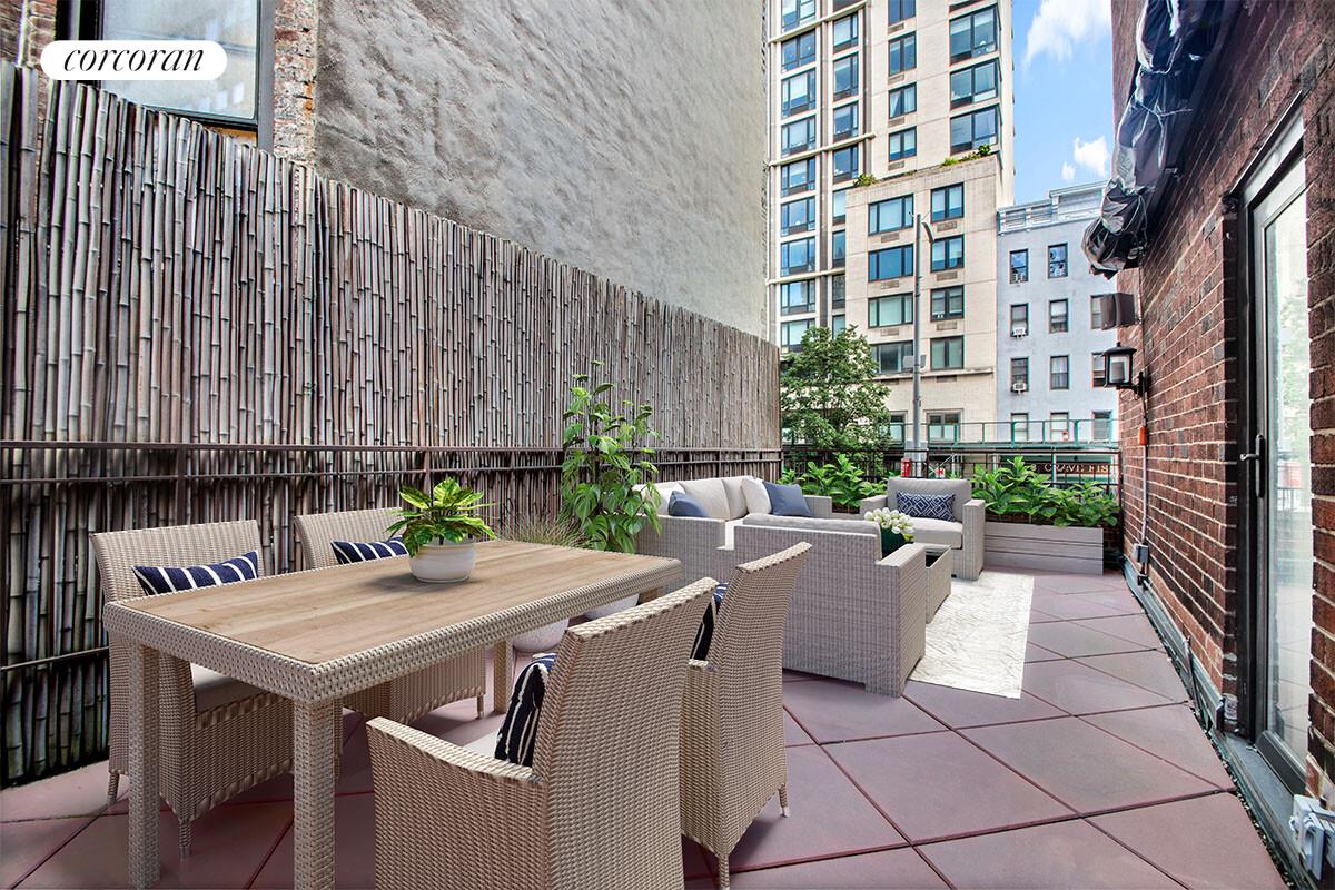 241 East 76th Street, Unit 2HI Manhattan, NY 10021 - Photo 12 of 27 a view of a patio with table and chairs and potted plants