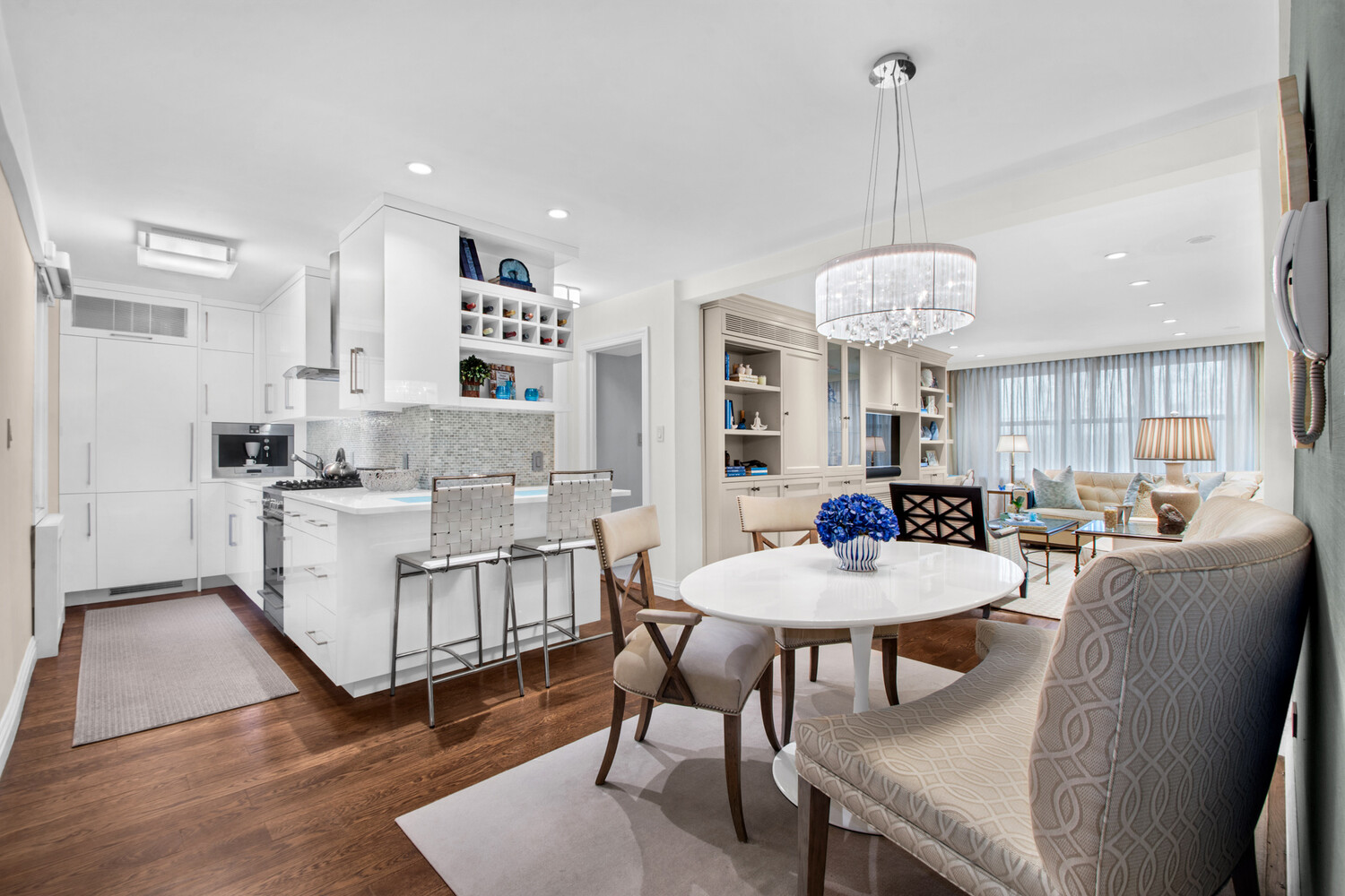 241 East 76th Street, Unit 2HI Manhattan, NY 10021 - Photo 14 of 27 a view of kitchen with dining table and chairs