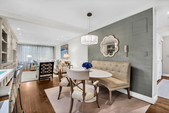 a kitchen with stainless steel appliances granite countertop a white cabinets and a refrigerator