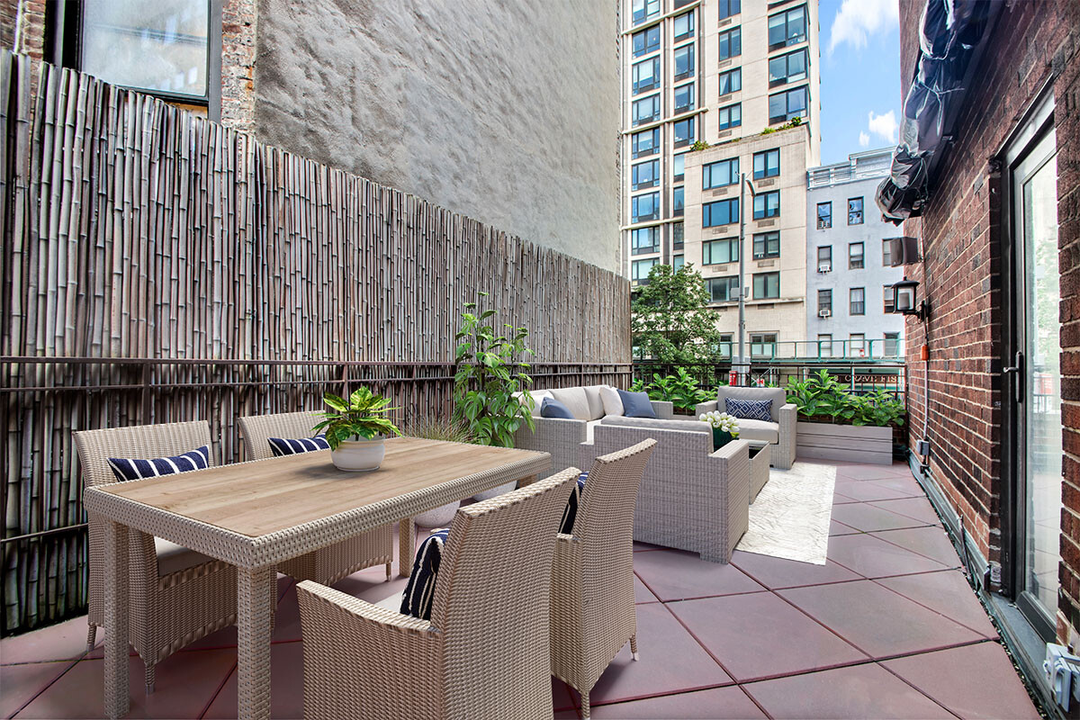 241 East 76th Street, Unit 2HI Manhattan, NY 10021 - Photo 25 of 27 a view of a patio with a table and chairs
