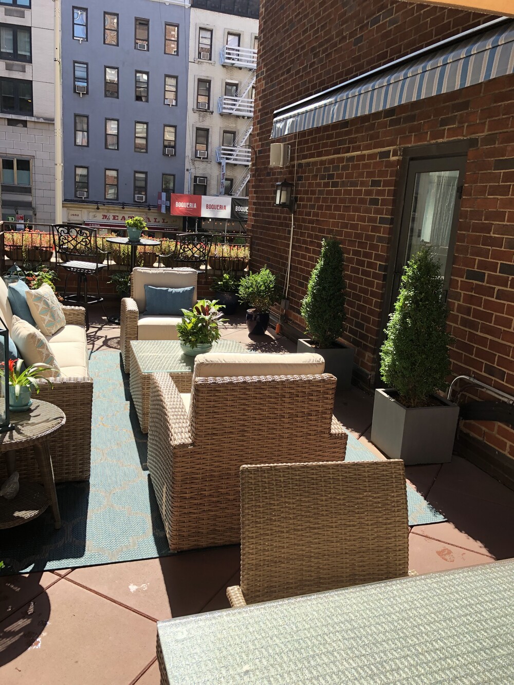 241 East 76th Street, Unit 2HI Manhattan, NY 10021 - Photo 26 of 27 a view of a patio with couches and a potted plant on a table