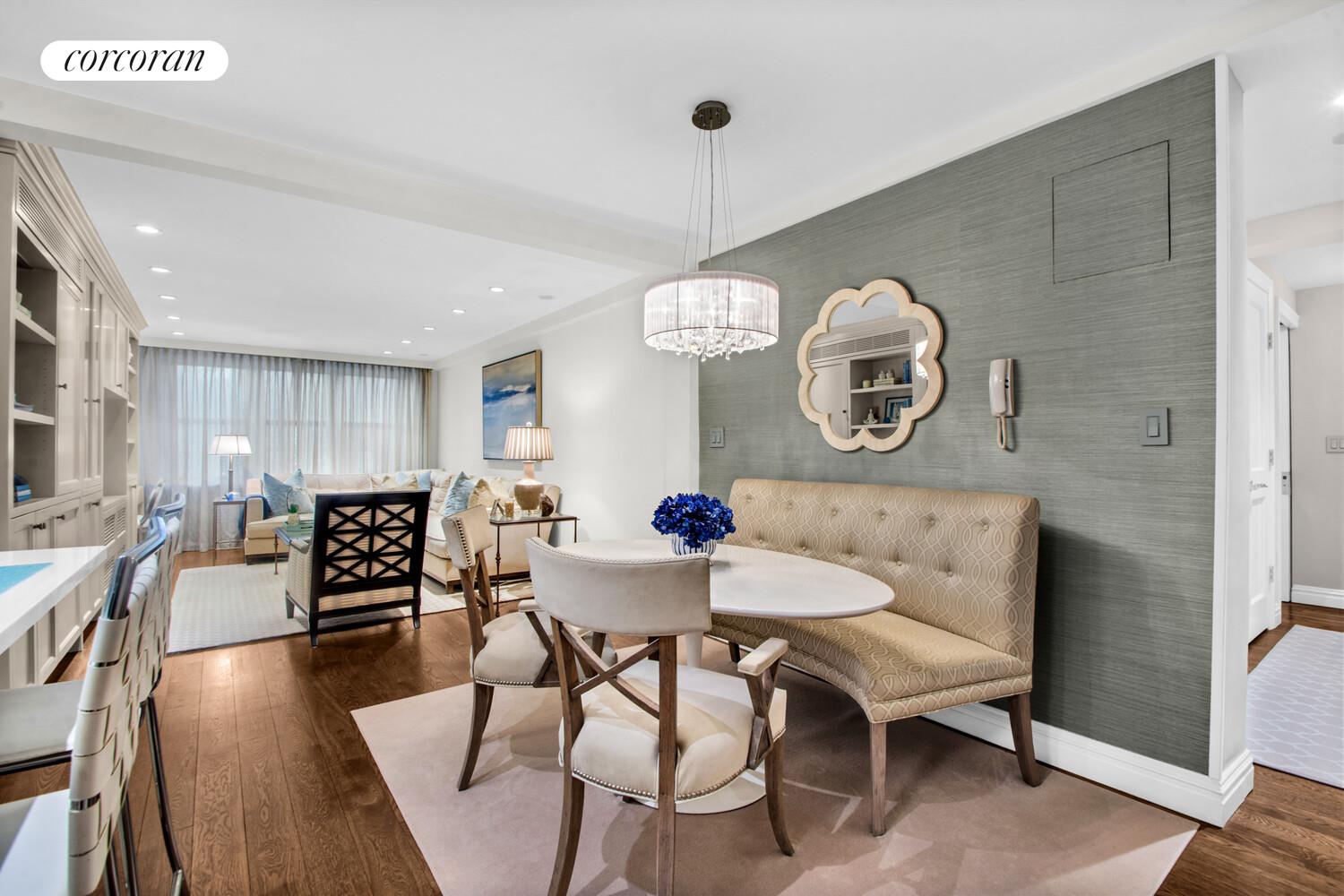 241 East 76th Street, Unit 2HI Manhattan, NY 10021 - Photo 3 of 27 a view of a dining room with furniture window and wooden floor