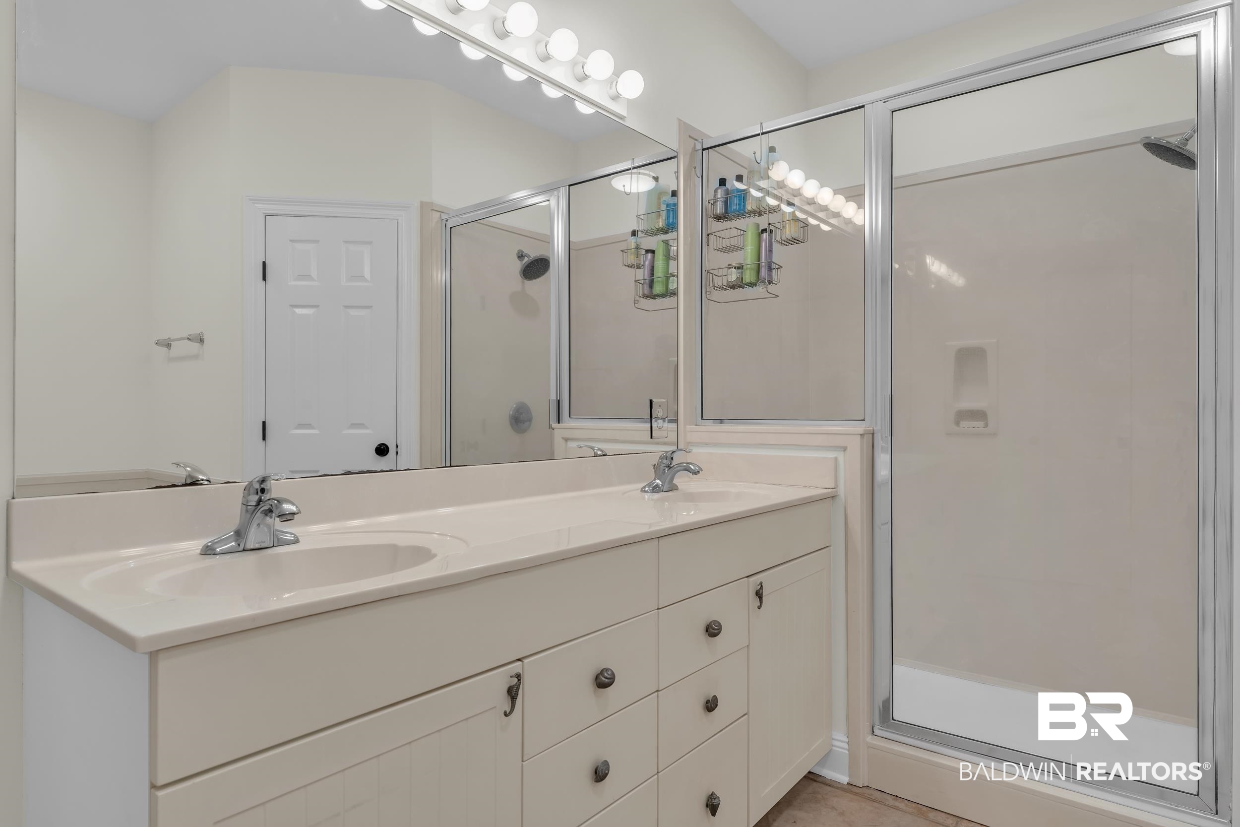 4606 Osprey Drive Orange Beach, AL 36561 - Photo 30 of 44 Full bathroom with a stall shower and double vanity