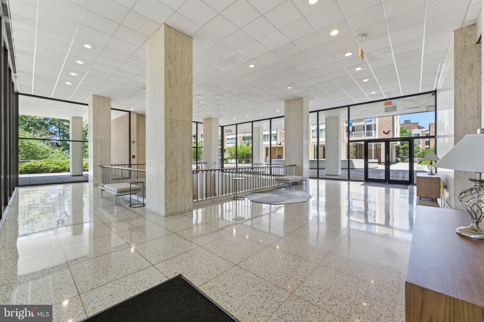 1435 4th Street Southwest, Unit B609 Washington, DC 20024 - Photo 40 of 52 a lobby with furniture and floor to ceiling windows