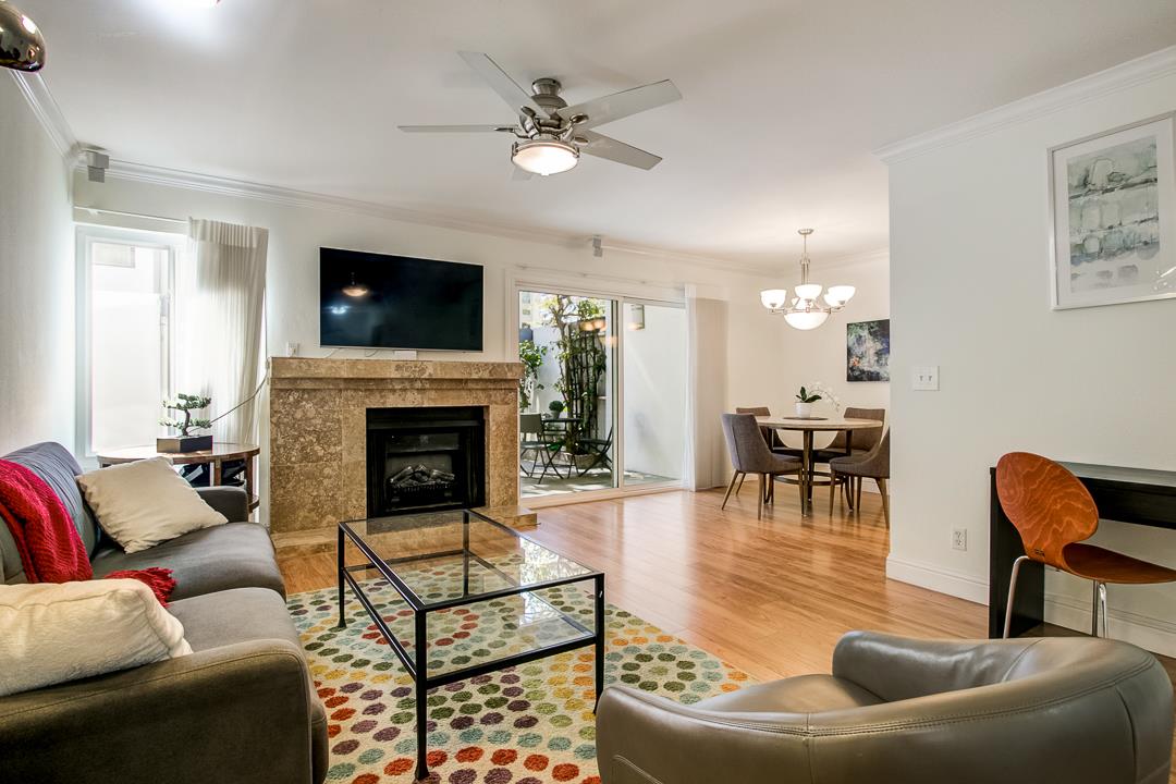 1049 Shell Boulevard, Unit 3 Foster City, CA 94404 - Photo 1 of 56 a living room with furniture and a fireplace