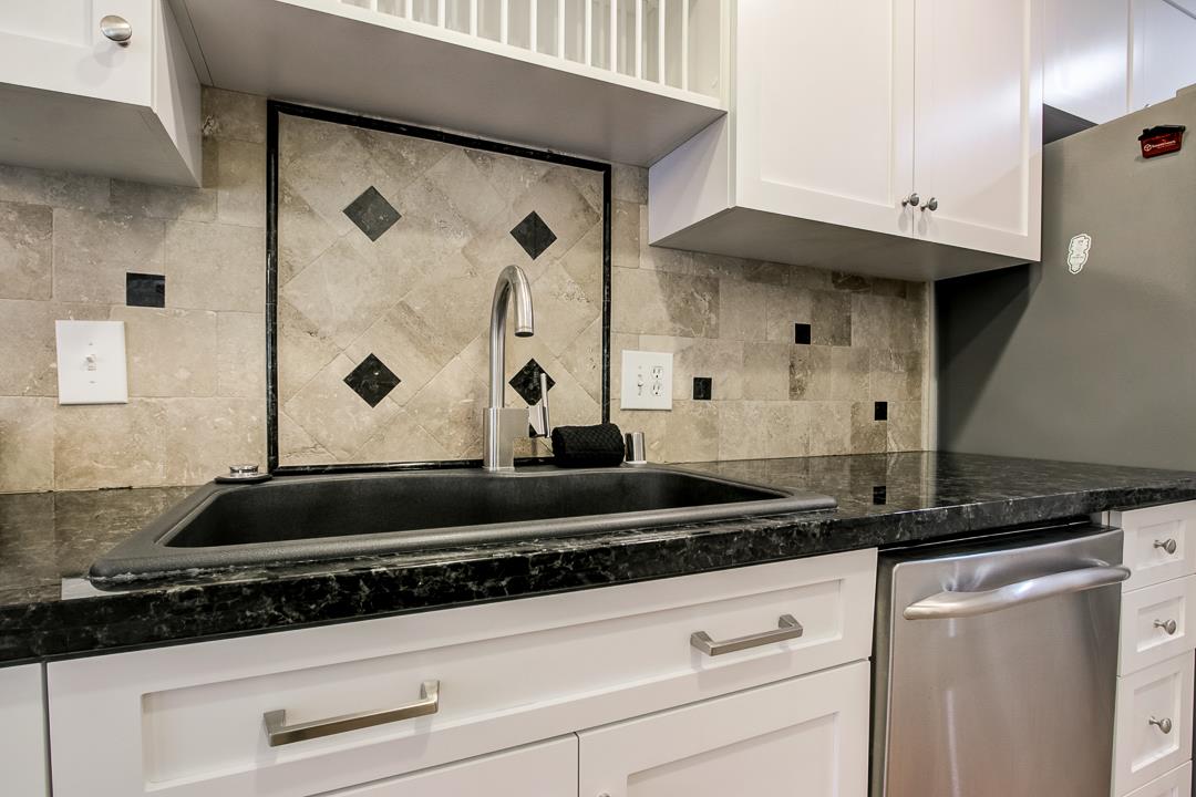 1049 Shell Boulevard, Unit 3 Foster City, CA 94404 - Photo 16 of 56 a close view of a stove a microwave and cabinets in the kitchen