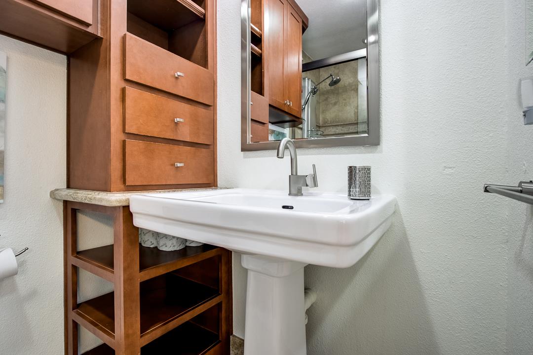 1049 Shell Boulevard, Unit 3 Foster City, CA 94404 - Photo 20 of 56 a bathroom with a sink and a mirror
