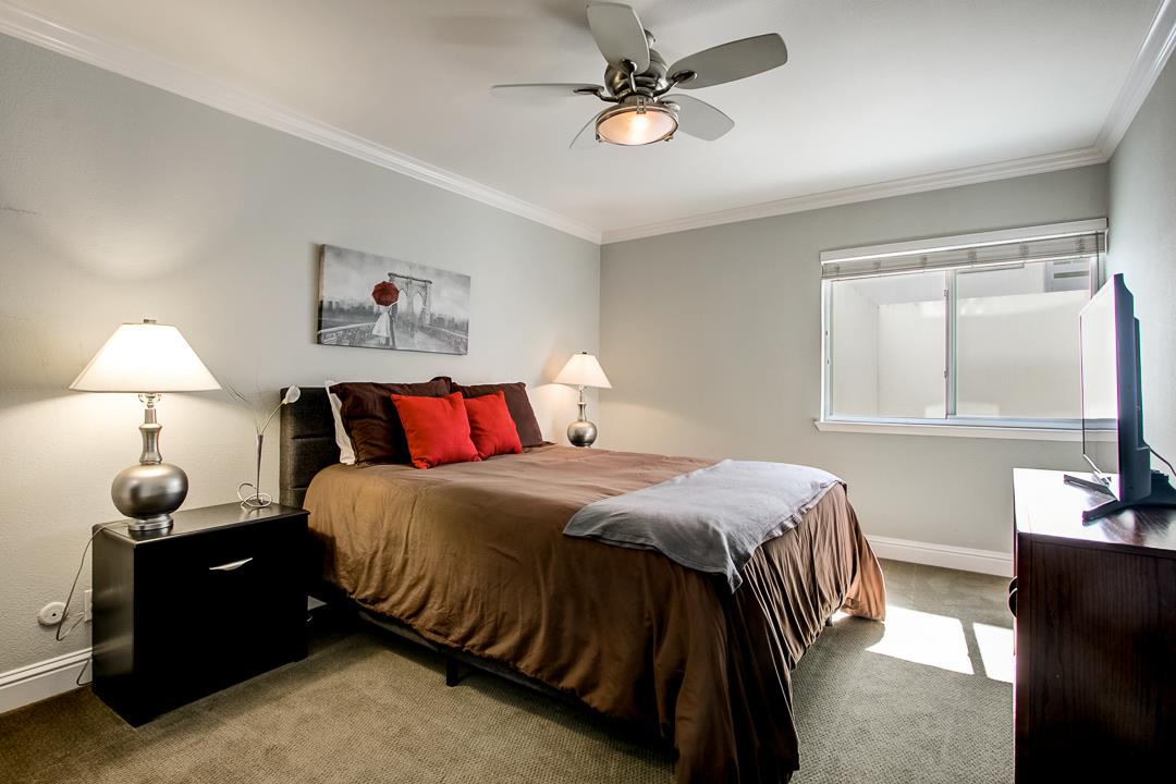 1049 Shell Boulevard, Unit 3 Foster City, CA 94404 - Photo 22 of 56 a bedroom with a bed and a window