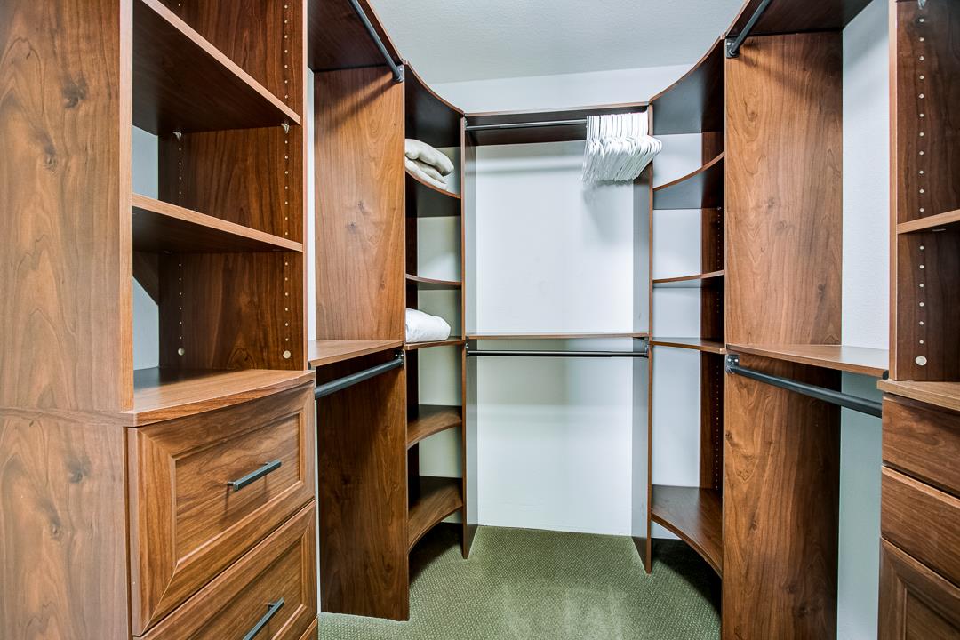 1049 Shell Boulevard, Unit 3 Foster City, CA 94404 - Photo 25 of 56 a view of walk in closet with clothes and shoes