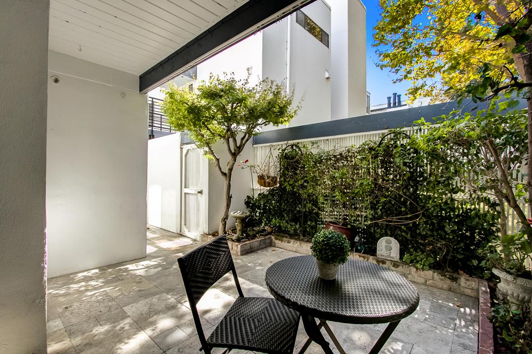 1049 Shell Boulevard, Unit 3 Foster City, CA 94404 - Photo 30 of 56 a living room with furniture and a potted plant