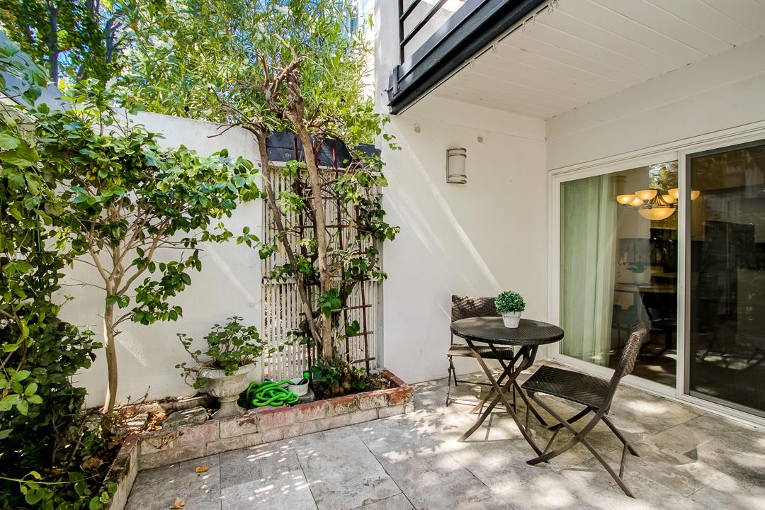 1049 Shell Boulevard, Unit 3 Foster City, CA 94404 - Photo 32 of 56 a backyard of a house with table and chairs