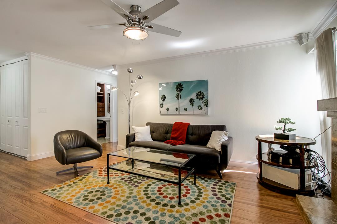 1049 Shell Boulevard, Unit 3 Foster City, CA 94404 - Photo 4 of 56 a living room with furniture and wooden floor