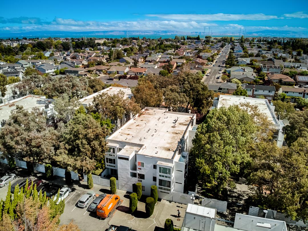 1049 Shell Boulevard, Unit 3 Foster City, CA 94404 - Photo 43 of 56 an aerial view of residential houses with outdoor space