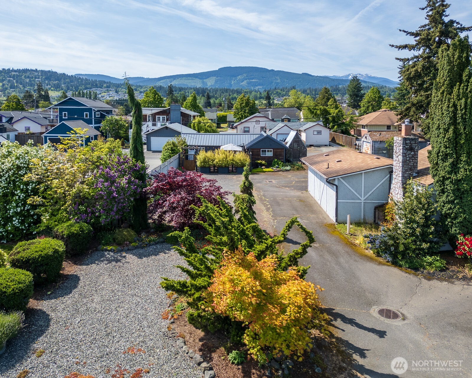233 West Washington Street Sequim, WA 98382 - Photo 2 of 40 a view of a houses with a garden
