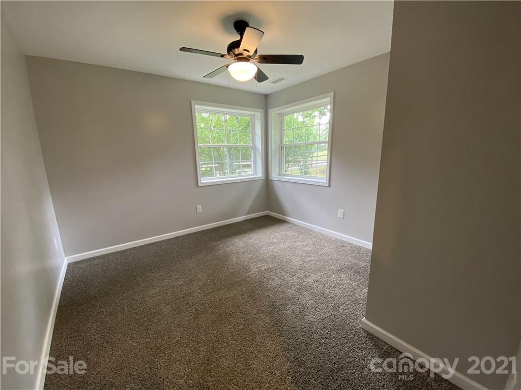 629 Thompson Road Rutherfordton, NC 28139 - Photo 10 of 10 an empty room with windows and fan
