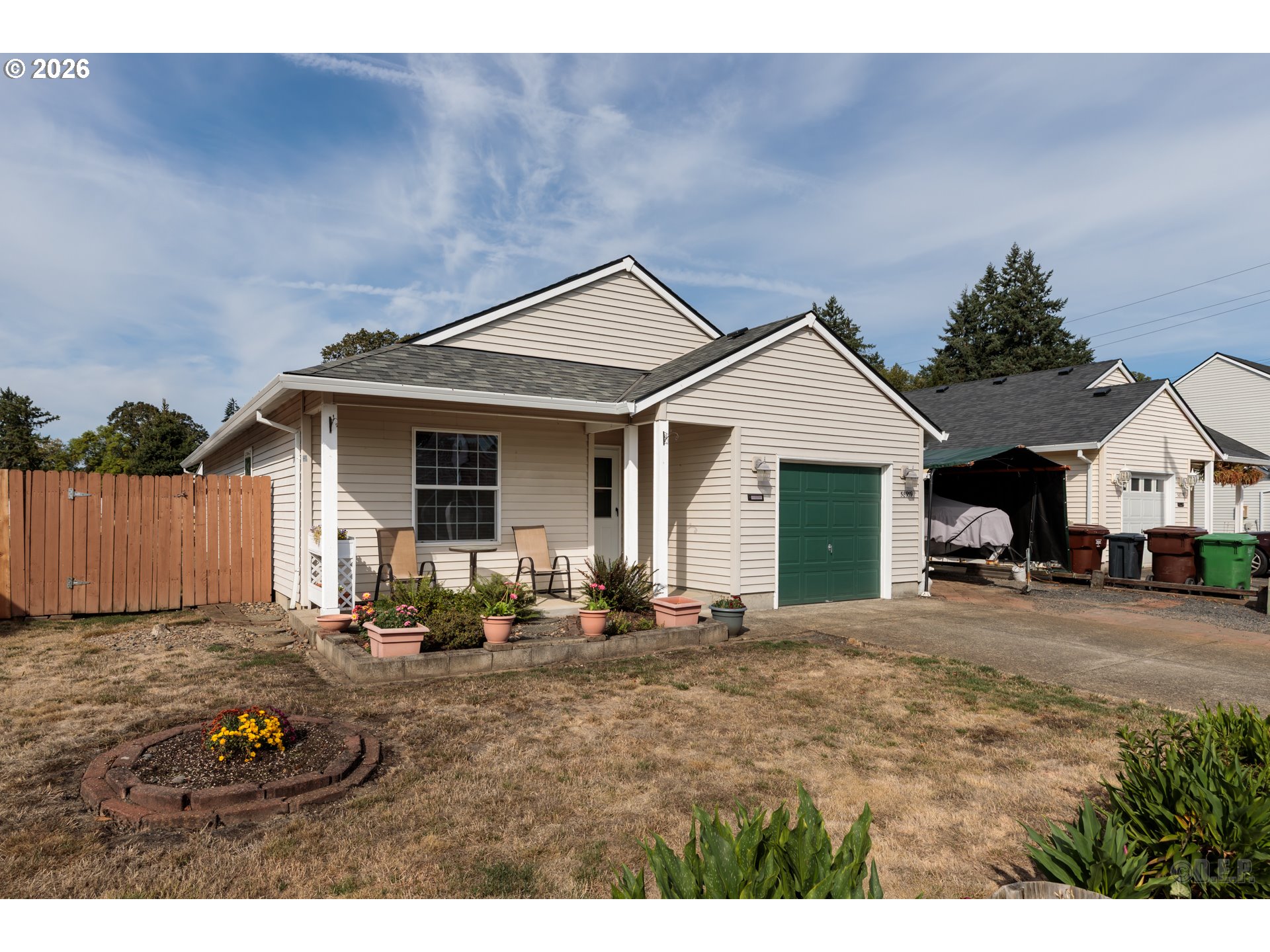 58959 Alexandra Lane St. Helens, OR 97051 - Photo 18 of 19 a front view of a house with a garden and porch