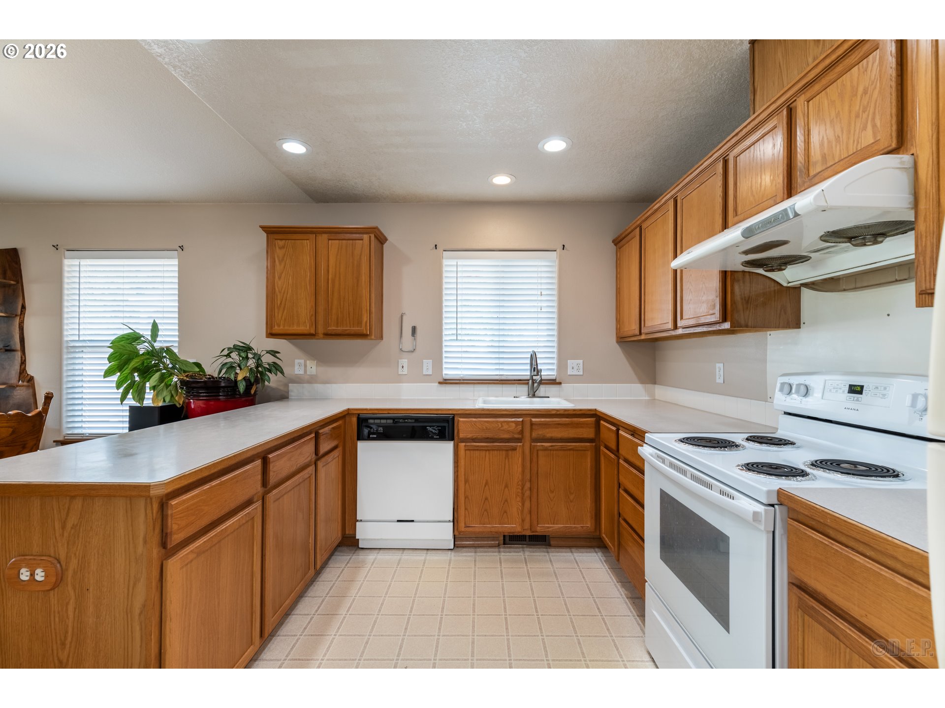 58959 Alexandra Lane St. Helens, OR 97051 - Photo 2 of 19 a kitchen with stainless steel appliances granite countertop a sink stove and cabinets
