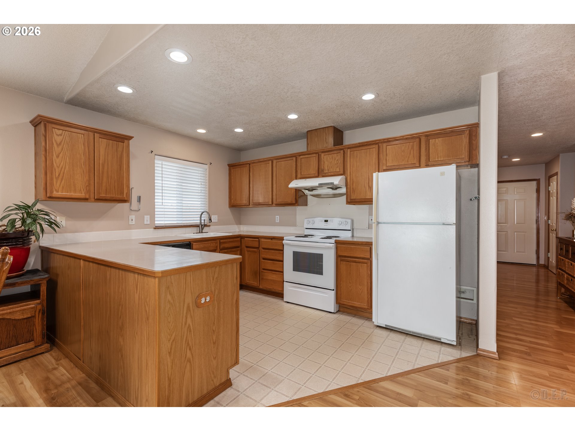 58959 Alexandra Lane St. Helens, OR 97051 - Photo 3 of 19 a kitchen with a refrigerator a sink and a microwave