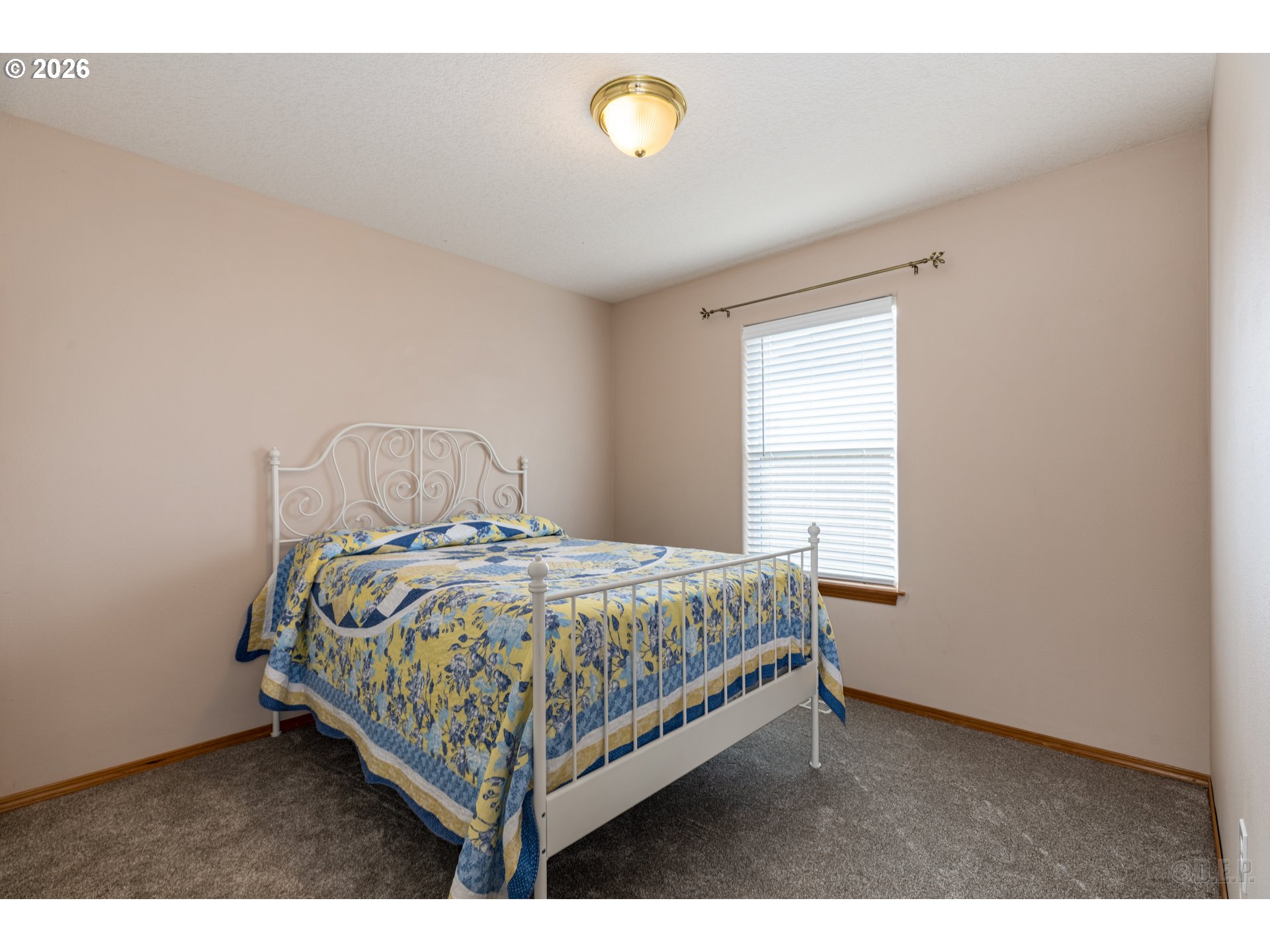 58959 Alexandra Lane St. Helens, OR 97051 - Photo 9 of 19 a bedroom with a bed and window