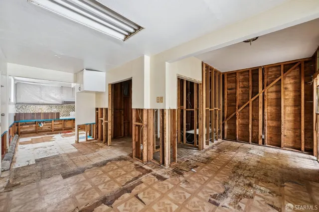 a backyard of a house with a tree