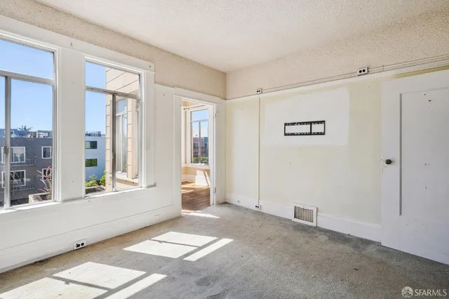 a view of an empty room with a window