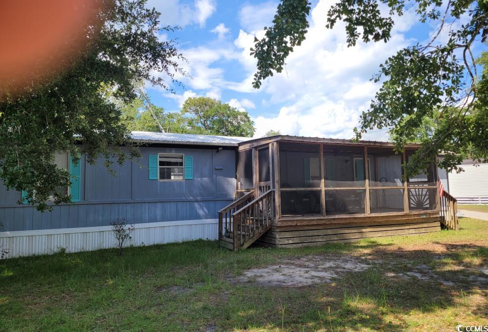 356 Calhoun Drive Murrells Inlet, SC 29576 - Photo 26 of 26 Back of property with a sunroom
