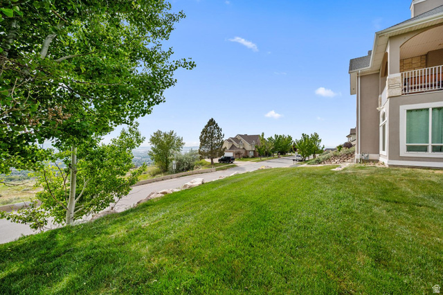 708 Eagle Rdg Drive Bountiful, UT 84010 - Photo 56 of 69 Sloped lawn with mature trees and landscaping