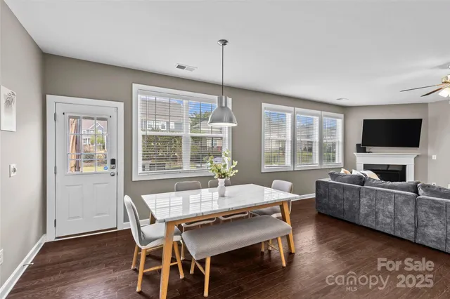a dining room with furniture window wooden floor